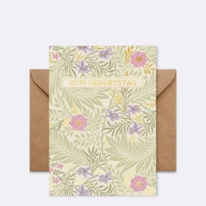 Doppelkarte mit floralen Mustern in Grün und Lila mit Schriftzug "ZUM GEBURTSTAG"