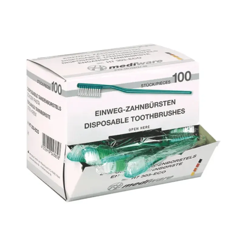 Eine Schachtel mit 100 Einmalzahnbürsten der Servoprax GmbH, beschriftet in Englisch und Deutsch. Die teilweise geöffnete Verpackung zeigt mehrere grüne Zahnbürsten im Inneren, auf denen der Produktname „Mediware Einmal-Zahnbürste ohne Zahnpulver grün – 100 Stück“ zu sehen ist.